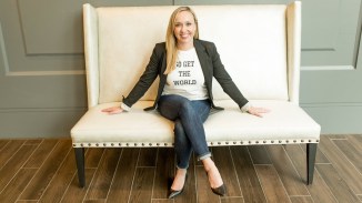 Amanda sitting on a sofa.