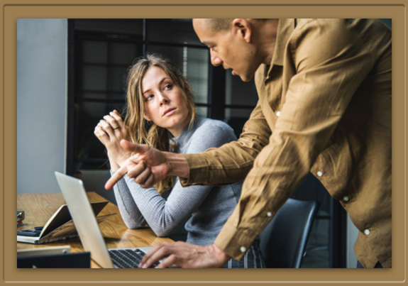 Woman looks incredulous at man.