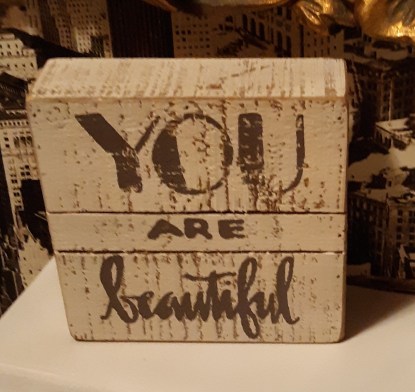 Plaque that reads "You are beautiful"