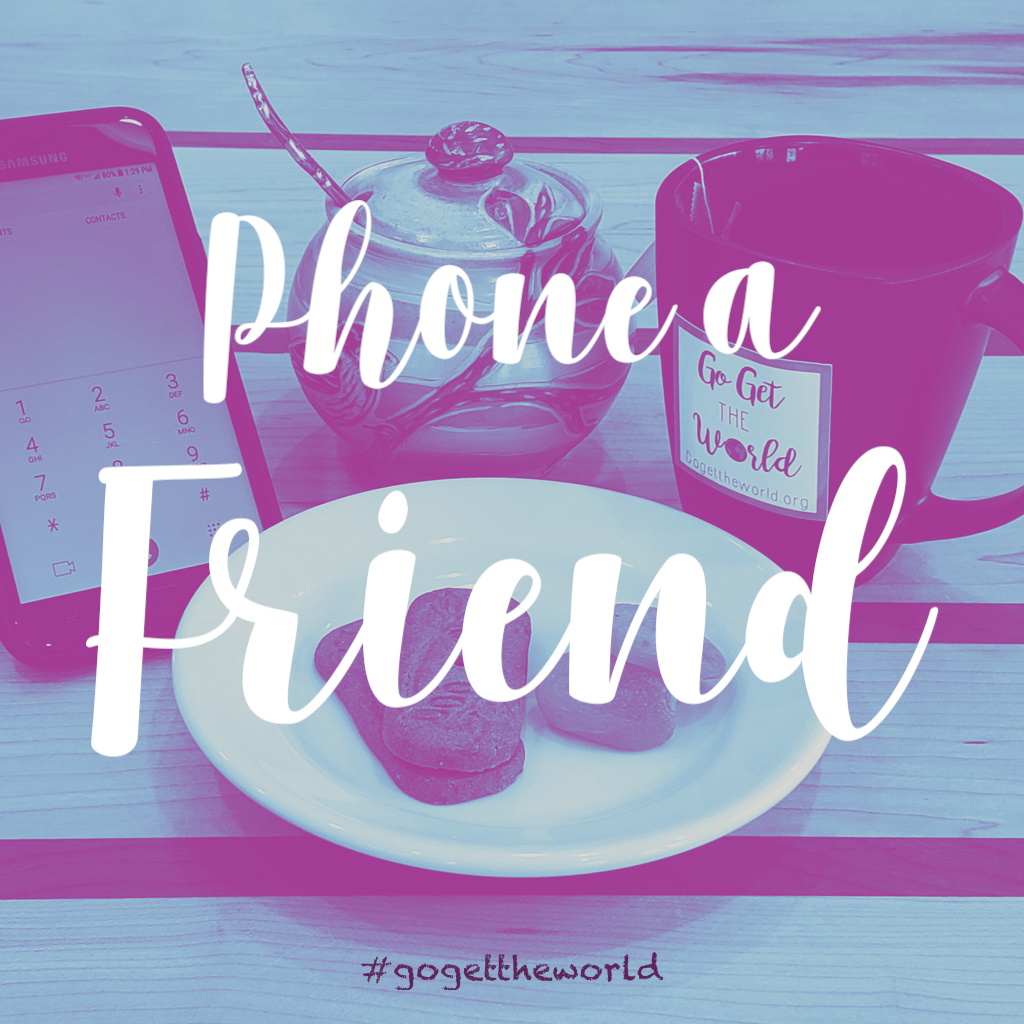 Having a cup of tea and cookies while phoning a friend.