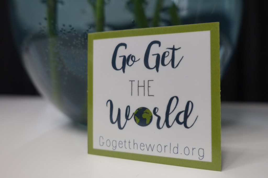 Photo of a Go Get The World sticker.