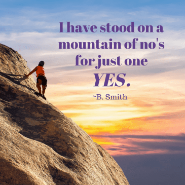 woman climbing a mountain